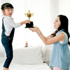 Asian daughter express exciting after get reward as trophy from her mother